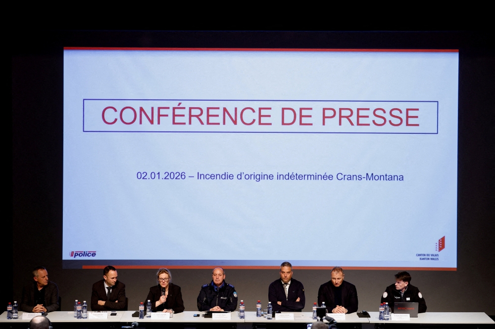 Eric Bonvin, general director of the Hospital du Valais, Mathias Reynard, state councillor and president of the Council of State of the Canton of Valais, Prosecutor Beatrice Pilloud, Regional police commander Frederic Gisler, Stephane Ganzer, state councillor and head of the Department of Security, Institutions and Sport of the Canton of Valais, Pierre-Antoine Lengen, head of the Swiss Judicial Police, and Dr Freddy-Michel Roten, director of Valais Cantonal Organisation of Emergency Services (OCVS) attend a press conference following a fire and an explosion at the ‘Le Constellation’ bar, during a New Year's Eve party in the upscale ski resort of Crans-Montana, in Sion, Switzerland January 2, 2026. — Reuters pic