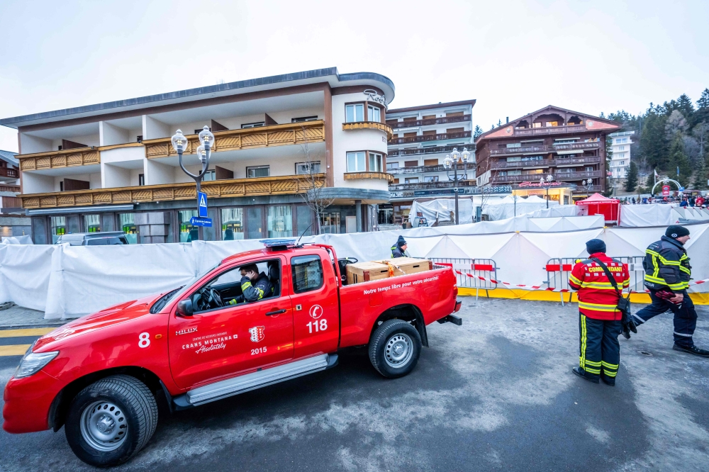 The blaze at a packed bar in the Alpine ski resort town of Crans-Montana killed at least 40 people and injured 119 others, authorities said. — AFP pic
