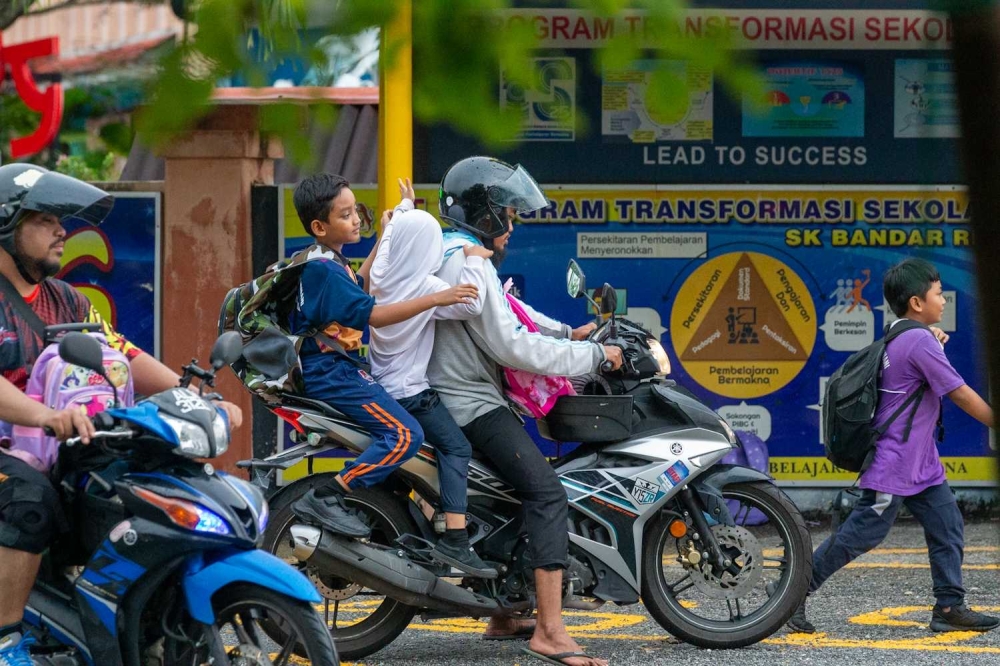 After nearly five years of Covid-19 related disruptions, parents and teachers are welcoming the return of the January school start as schools nationwide revert to a January academic year from 2026. — Picture by Raymond Manuel