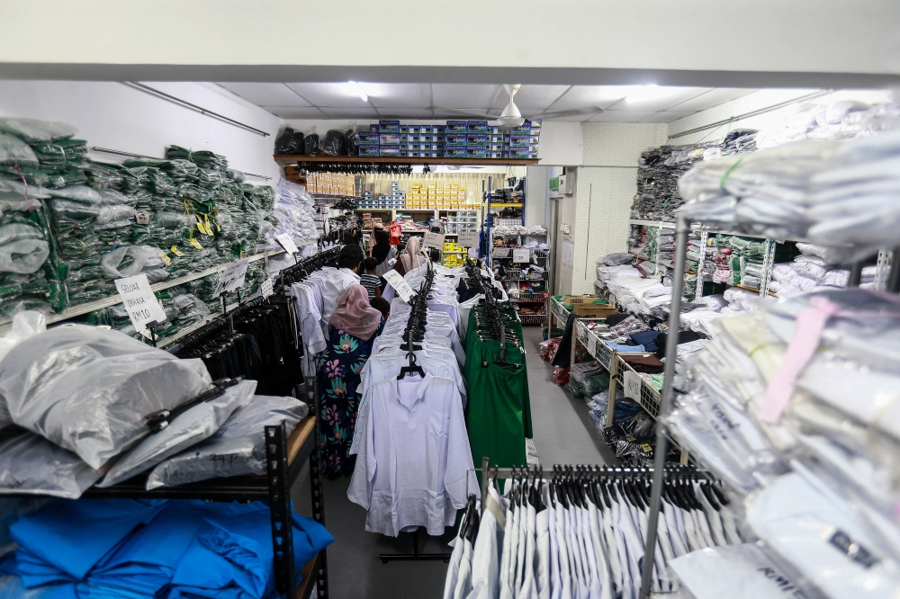Businesses have not seen a major impact from the January school reopening, as customers continue to visit stores for essential school supplies. — Picture by Sayuti Zainudin