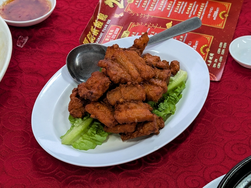 Crispy, fatty with lots of mild garlic flavour, the garlic fried pork is a popular item. — Picture by Ethan Lau