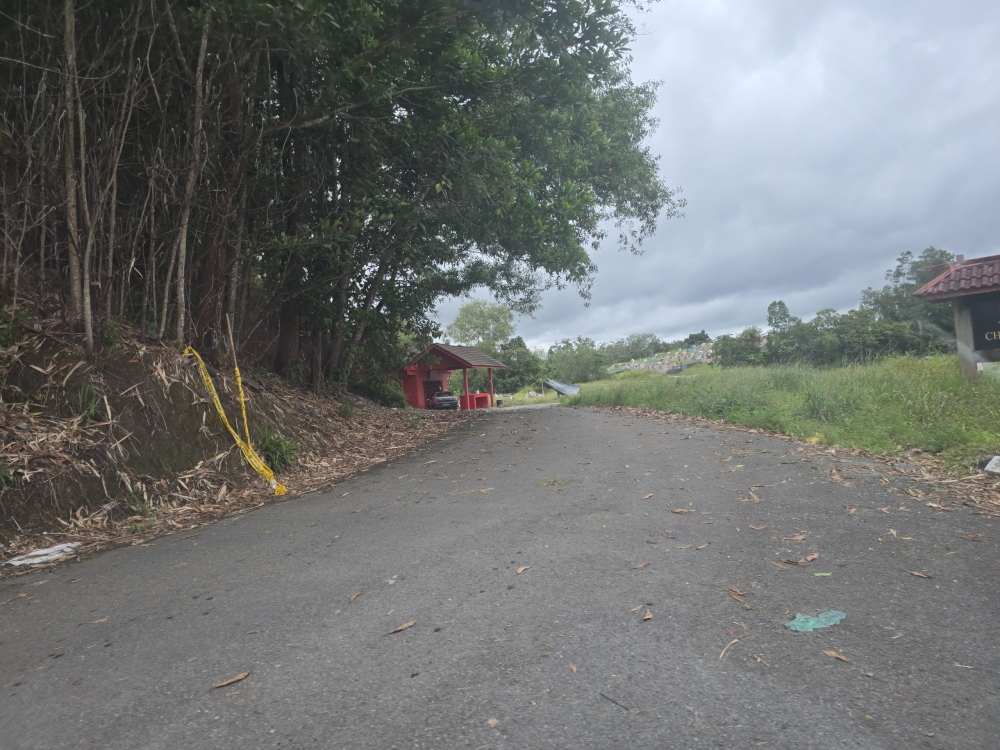 The arrest follows the discovery of a 67-year-old grave builder who was found dead, while his son was injured and hospitalised. — The Borneo Post pic