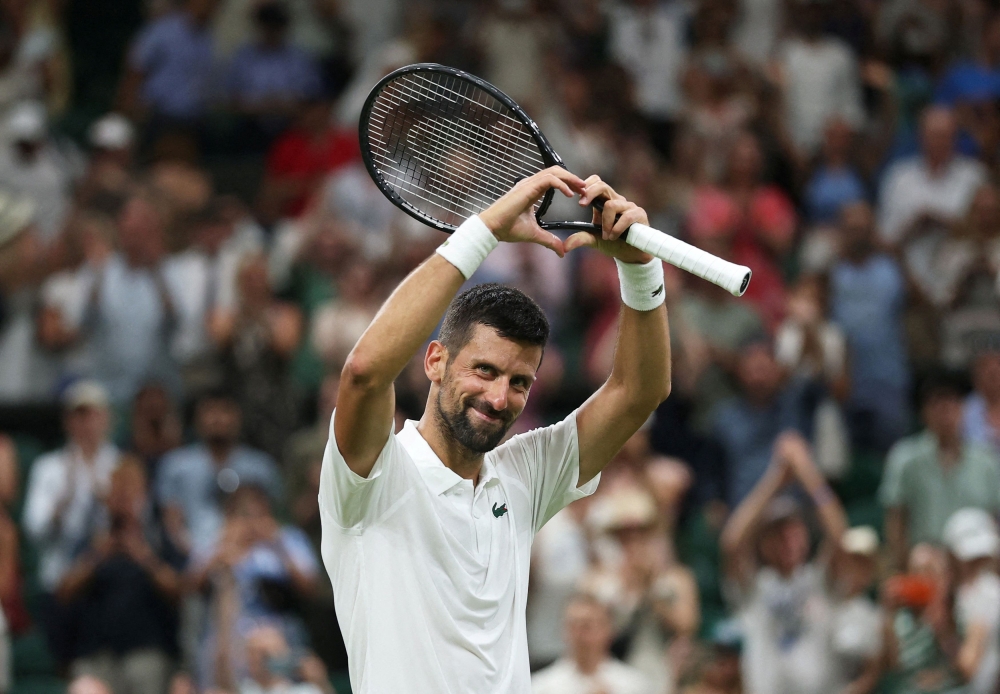 Serbia’s Novak Djokovic celebrates winning his first round match against France’s Alexandre Muller at the All England Lawn Tennis and Croquet Club, London, July 1, 2025. — Reuters pic