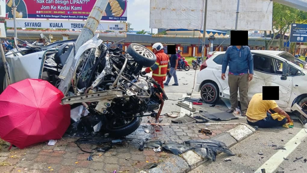 Debris is seen at the scene of a fatal road accident in Bukit Kecil, Kuala Terengganu, involving a Perodua Viva and a Honda Jazz. — Social media pic