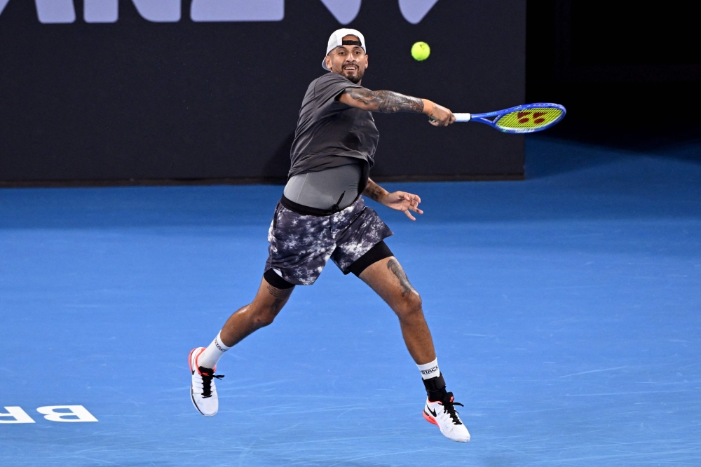 Nick Kyrgios hits a return as he and Thanasi Kokkinakis of Australia play during their men's doubles match against Matthew Ebden of Australia and Rajeev Ram of the US at the Brisbane International tennis tournament in Brisbane on January 4, 2026. — AFP pic
