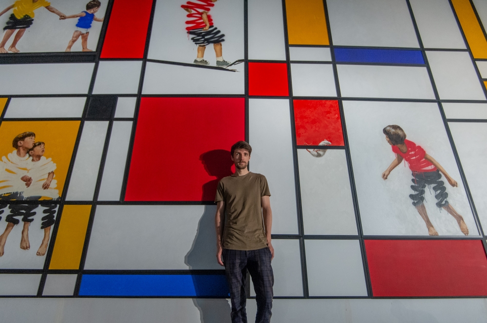 Lithuanian-born artist Ernest Zacharevic with one of his works featured at RexKL back in 2022.— Picture by Shafwan Zaidon