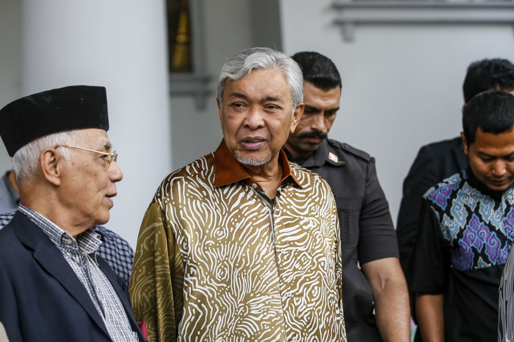 Deputy Prime Minister Datuk Seri Ahmad Zahid Hamidi leaves the court complex in Kuala Lumpur in this file photo, amid questions over the Attorney General’s Chambers’ decision to take no further action in the Yayasan Akalbudi case. — Picture by Hari Anggara