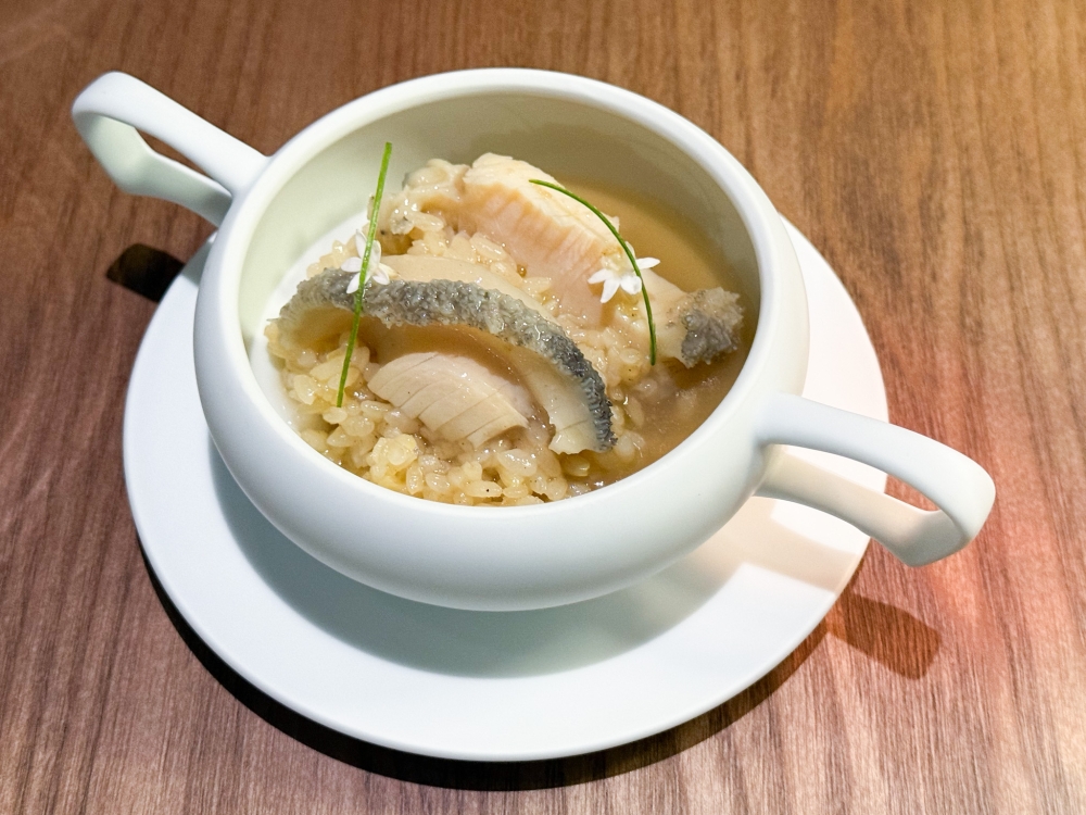 Japanese abalone is cooked till tender with rice in a broth using traditional Chinese herbs. — Picture by Lee Khang Yi