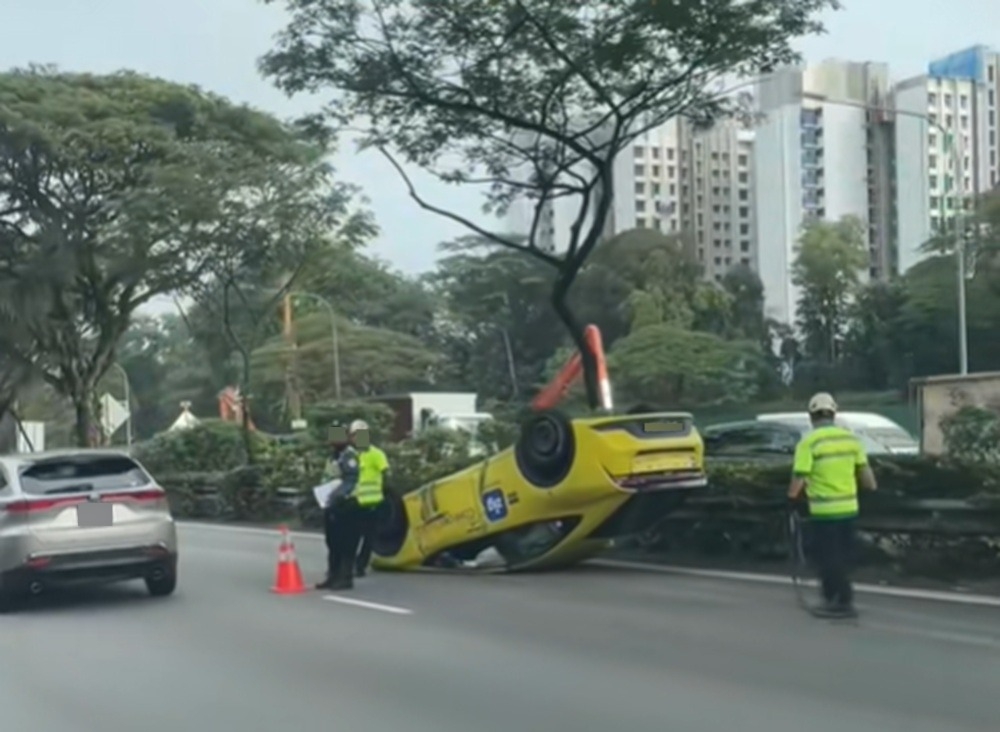 Taxi overturns on Singapore’s Pan Island Expressway, sending driver and passenger to hospital (VIDEO)