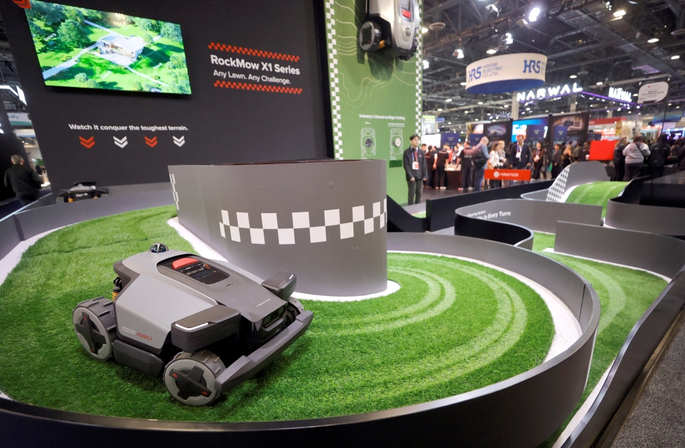 A RockMow X1 series robotic lawn mower by Roborock travels on a course during CES 2026 in Las Vegas, Nevada on January 7, 2026. — Reuters pic
