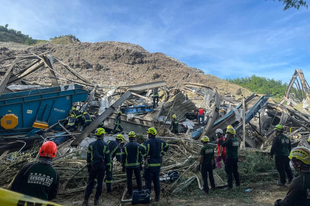 Dozens buried after massive landfill collapse in Philippines, death toll rises