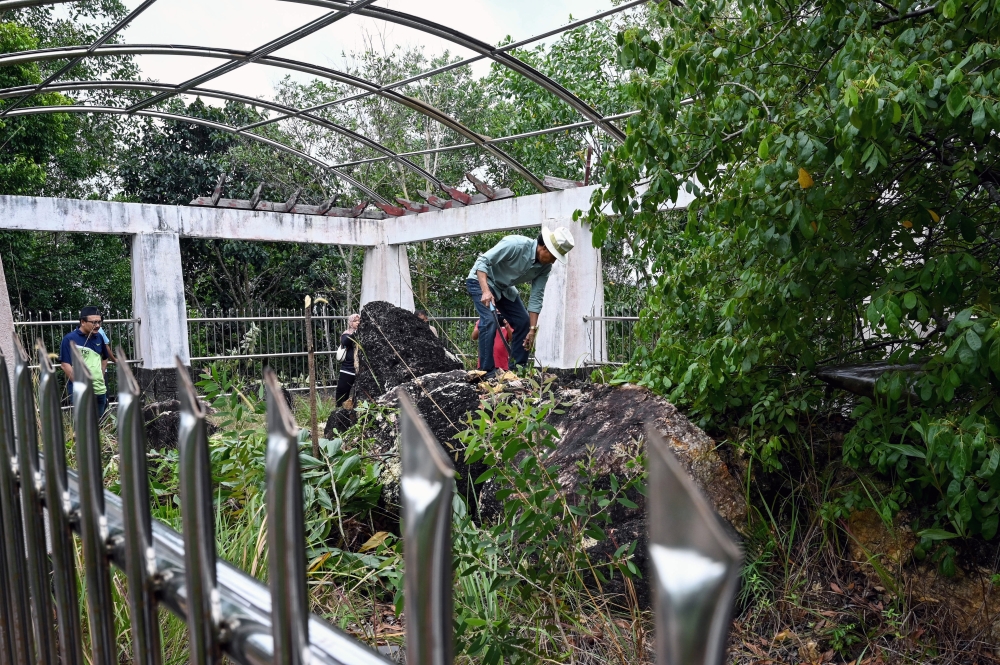 The ‘turtle stone’ at Bukit Che Hawa in Rantau Abang, once sheltered and maintained, is now exposed to the elements, prompting concern from heritage advocates. — Bernama pic