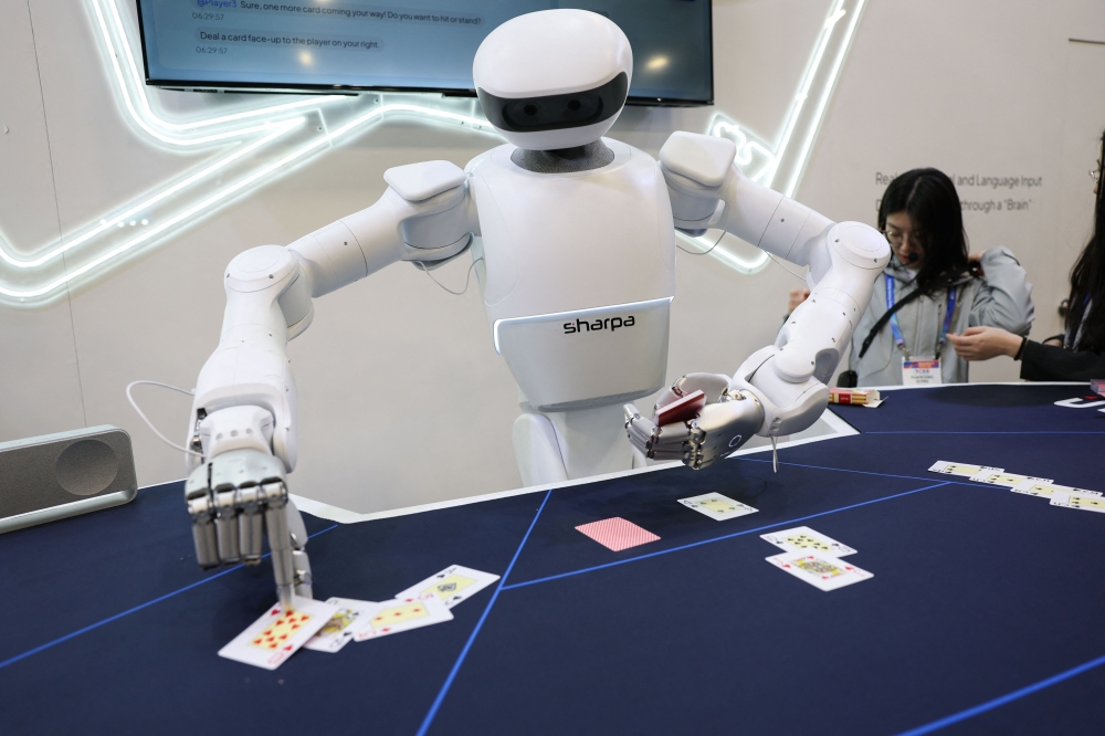 A Sharpa robot deals cards for a game of blackjack during the annual Consumer Electronics Show (CES) in Las Vegas, Nevada on January 6, 2026. — AFP pic