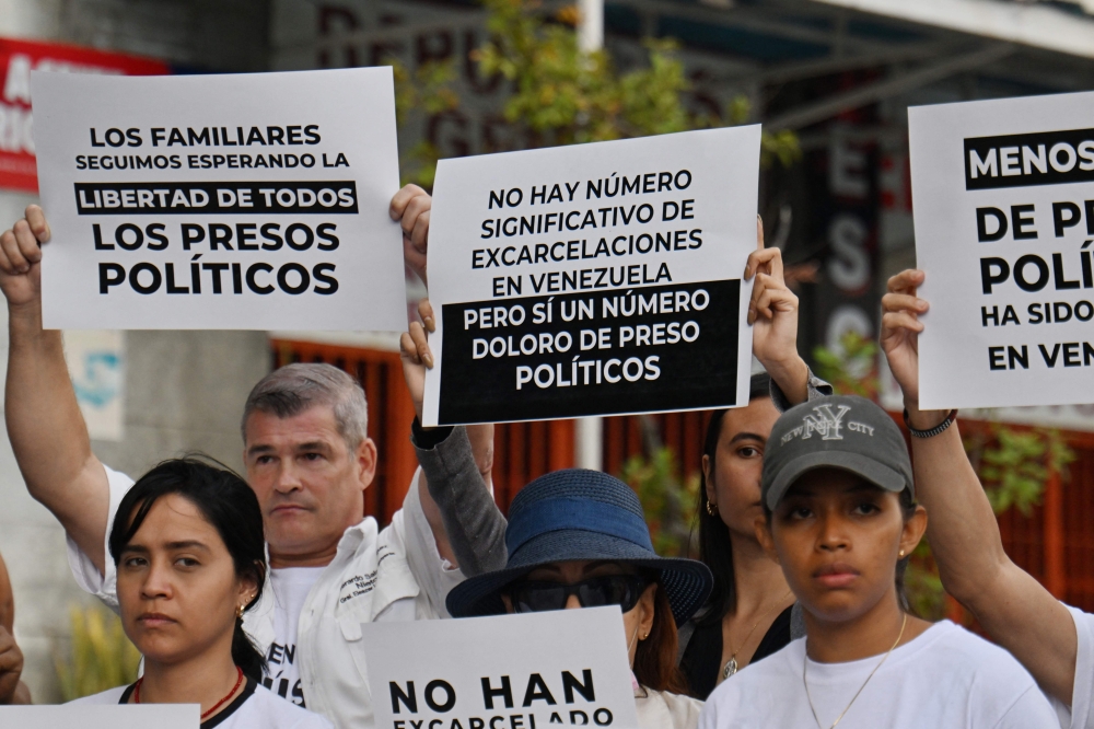 Relatives of political prisoners demonstrate in demand of the release of their loved ones, near the notorious El Helicoide — a facility and prison owned by the Venezuelan government and used for both regular and political prisoners of the Bolivarian National Intelligence Service (SEBIN) — in Caracas on January 9, 2026. — AFP pic 