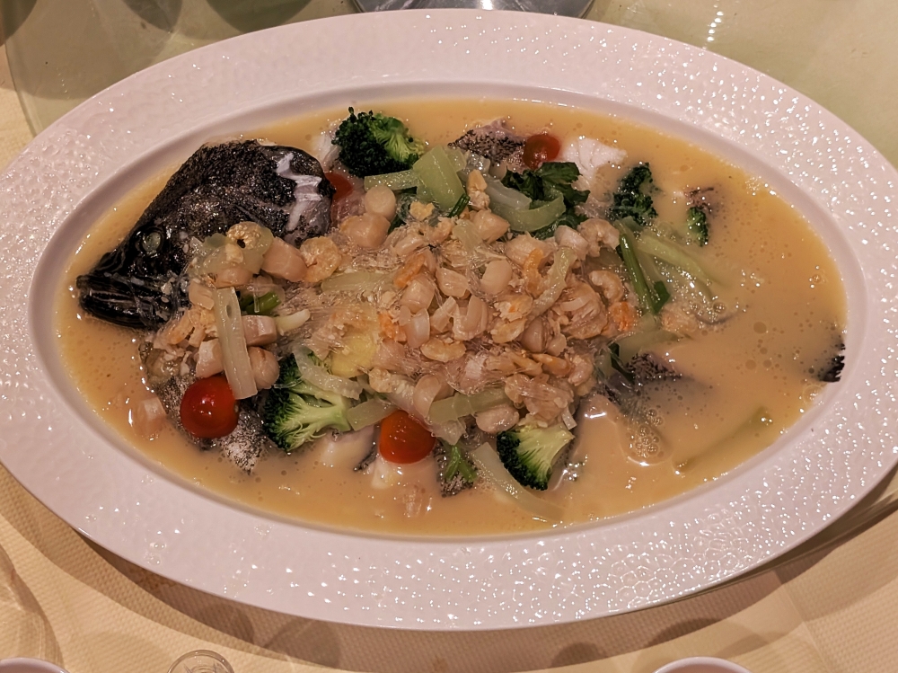 The Steamed Tiger Grouper with Loofah, Dried Scallops, Dried Shrimp & Vermicelli shows off an incredibly extracted, rich fish broth. — Picture by Ethan Lau