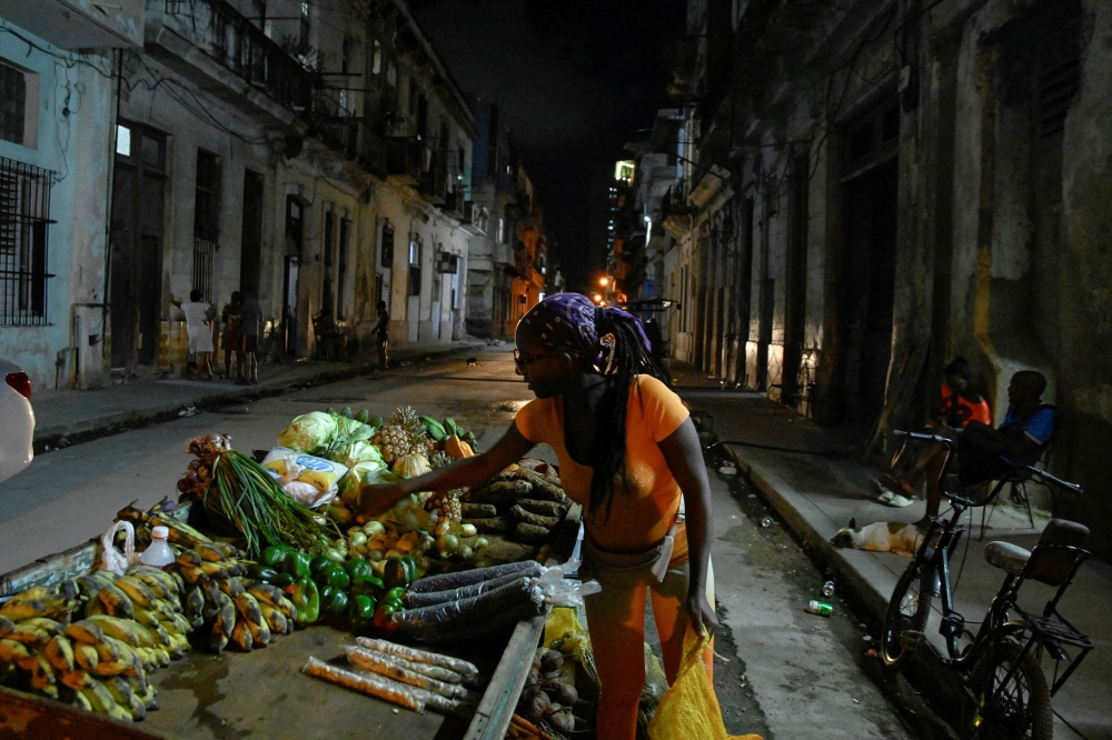 Laura Rosa sells produce in Havana after power returns from a grid collapse, December 3, 2025. — Reuters pic