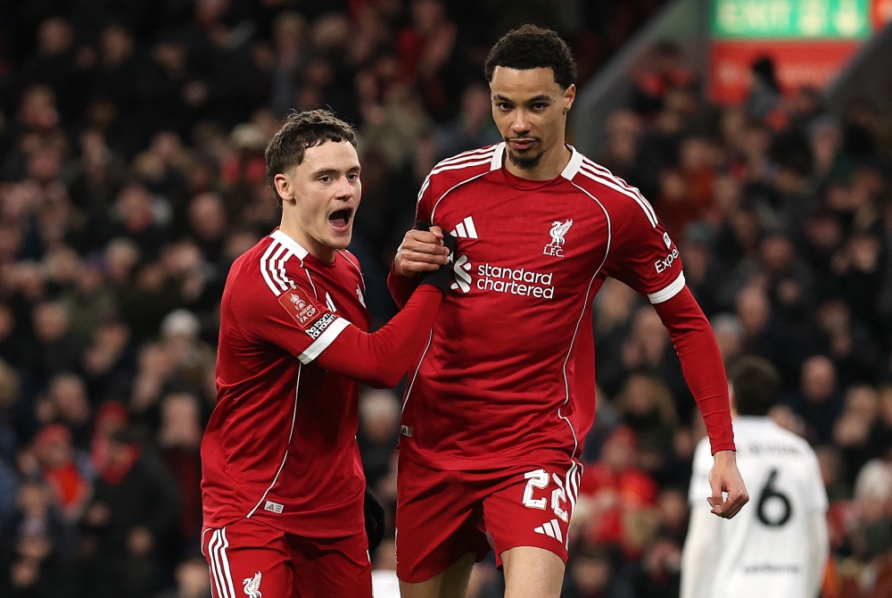 Liverpool’s Florian Wirtz celebrates scoring his side’s third goal with teammate Hugo Ekitike during their FA Cup third-round match against Barnsley at Anfield, Liverpool, on January 12, 2026. — Reuters pic