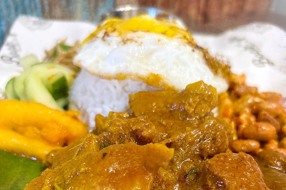 The signature Best Pork Curry Nasi Lemak at Bookafe Pork Nasi Lemak and Pasta. — Picture by CK Lim