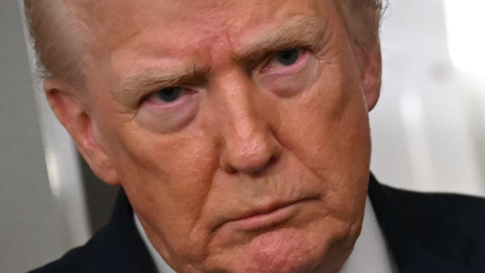 US President Donald Trump speaks to the press aboard Air Force One on January 11, 2026. — AFP pic