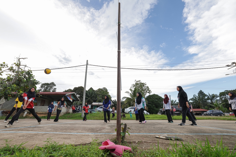 Villagers unwind with evening volleyball in Lamag. — Bernama pic