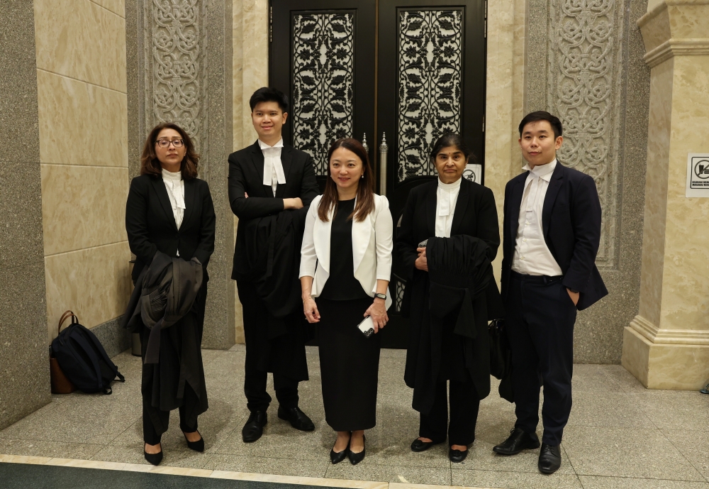 Federal Territories Minister Hannah Yeoh with her legal team after the Court of Appeal delivered its decision on her appeal against the High Court’s dismissal of her defamation suit against Tan Sri Musa Hassan over statements made at a forum at UiTM, at Court of Appeal 6, Putrajaya, January 13, 2026. — Bernama pic 
