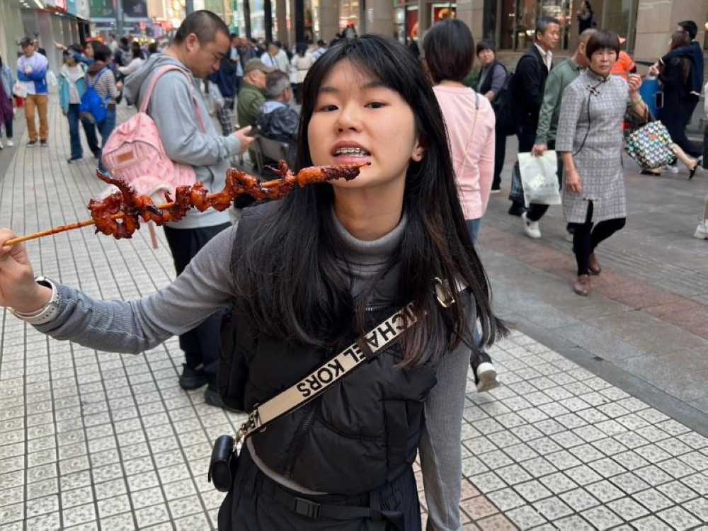 Yap Shing Xuen posing for a photo during a family trip to Shenzhen, China in 2024. — Picture courtesy of Wong Lee Ping