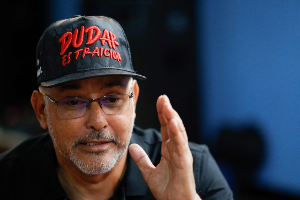 Alfredo Canchica, member of ‘3 Raices,’ a pro-government group known as ‘Colectivos,’ gestures as he speaks during an interview with AFP in Caracas on January 7, 2026. — AFP pic 