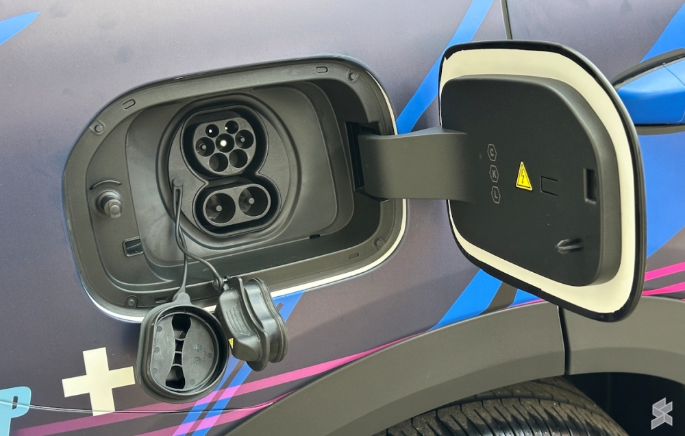 The Proton e.MAS 7 PHEV supports plug-in charging, allowing drivers to run on electric power alone for daily commutes before the petrol engine steps in.