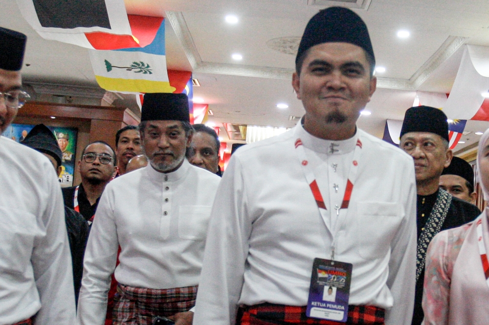 Khairy Jamaluddin (left) walks beside Umno Youth chief Datuk Dr Akmal Saleh as they enter the Umno Youth assembly at the World Trade Centre Kuala Lumpur on January 15, 2026. — Picture by Sayuti Zainudin