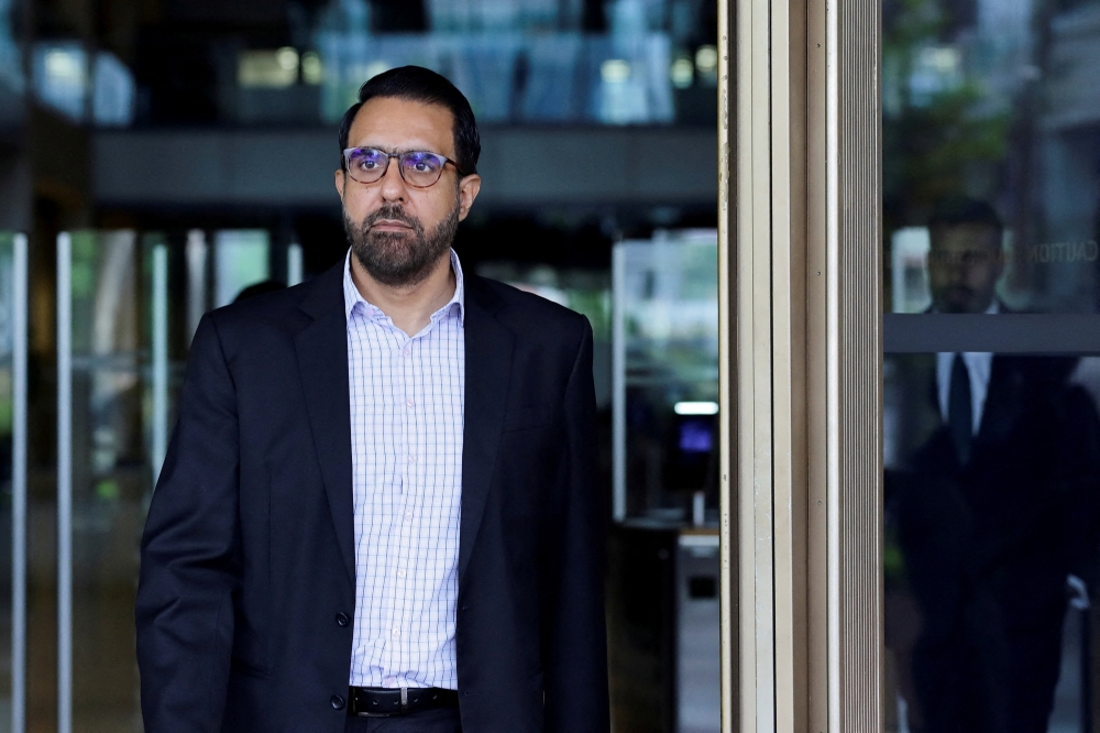 Pritam Singh, then Leader of the Opposition, leaves the Supreme Court after his appeal over his conviction for lying to a parliamentary committee was dismissed in Singapore on December 4, 2025. — Reuters pic