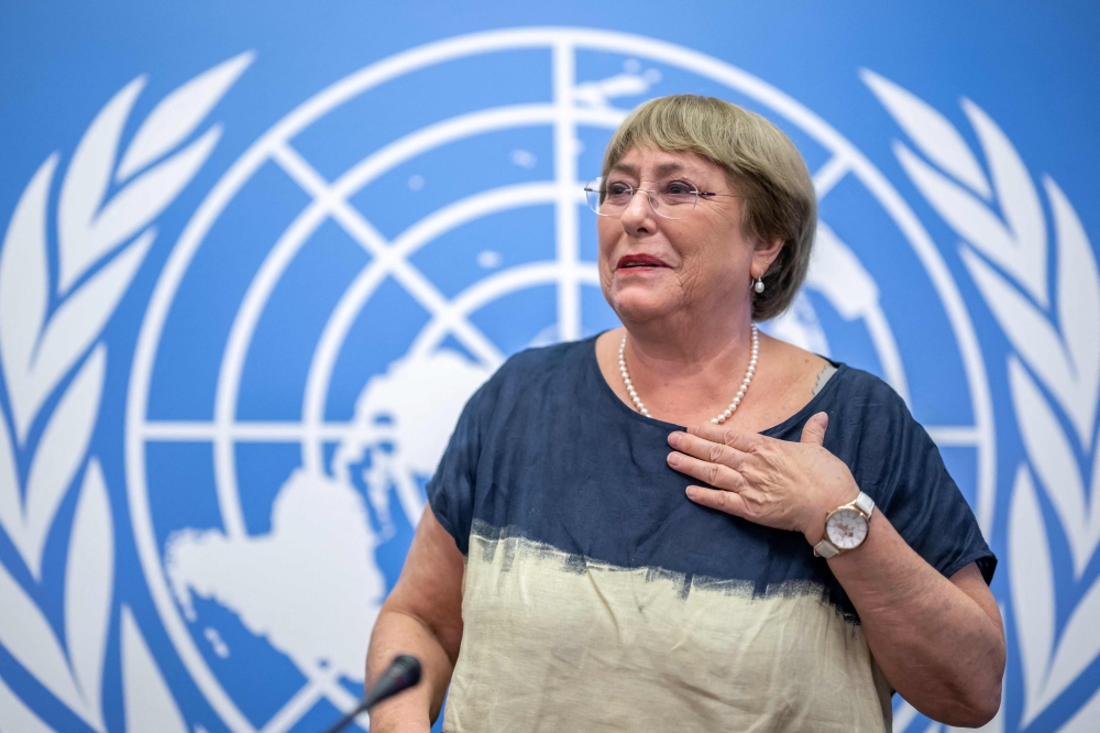 Outgoing United Nations High Commissioner for Human Rights Michelle Bachelet leaves after giving a final press conference at the United Nations offices in Geneva on August 25, 2022. — AFP pic