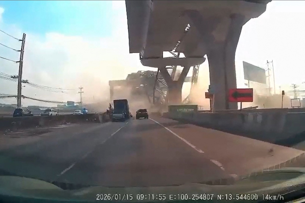 This screen grab made from UGC handout dashboard camera footage courtesy of Facebook user Real Champ taken and released on January 15, 2026 shows a crane falling at the under-construction Rama II Expressway in Samut Sakhon province, outside Bangkok. — AFP pic