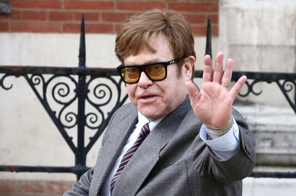Singer Elton John and his husband David Furnish are among those suing Associated Newspapers Limited over alleged unlawful information gathering. — Reuters pic
