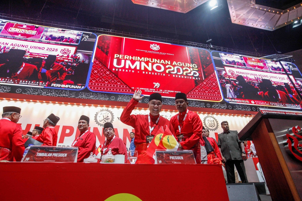 Umno President Datuk Seri Ahmad Zahid Hamidi reacts after delivering his keynote address during the 2025 Umno General Assembly at the World Trade Centre Kuala Lumpur. — Picture by Sayuti Zainudin