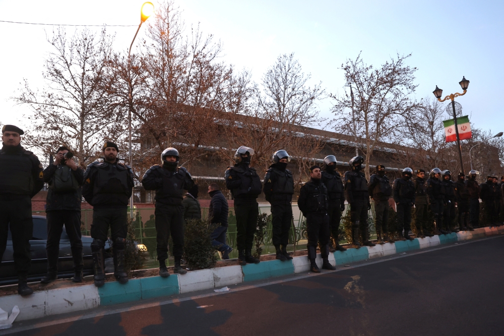Members of the Iranian police stand guard at a protest in front of the British embassy following anti-government protests in Tehran January 14, 2026. — Majid Asgaripour/Wana (West Asia News Agency) pic via Reuters 