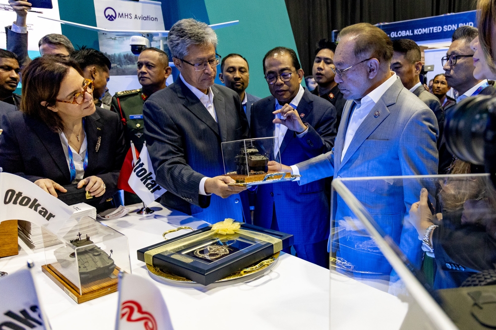Prime Minister Datuk Seri Anwar Ibrahim and Defence Minister Datuk Seri Mohamed Khaled Nordin visit the exhibition booths after the launch of the National Defence Industry Policy at Malaysia International Trade and Exhibition Centre in Kuala Lumpur January 21, 2026. — Picture by Firdaus Latif