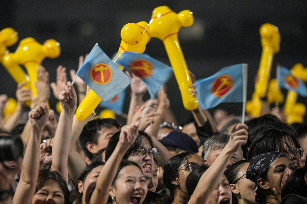 Supporters attend a Opposition Workers’ Party rally in Singapore ahead of the general election in May 2025. The party says only its chief can legitimately serve as Singapore’s Leader of the Opposition. — AFP pic