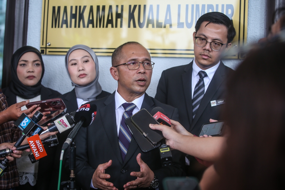 Deputy public prosecutor Datuk Wan Shaharuddin Wan Ladin speaks to reporters at the Kuala Lumpur High Court Complex on January 22, 2026. — Picture by Yusof Isa
