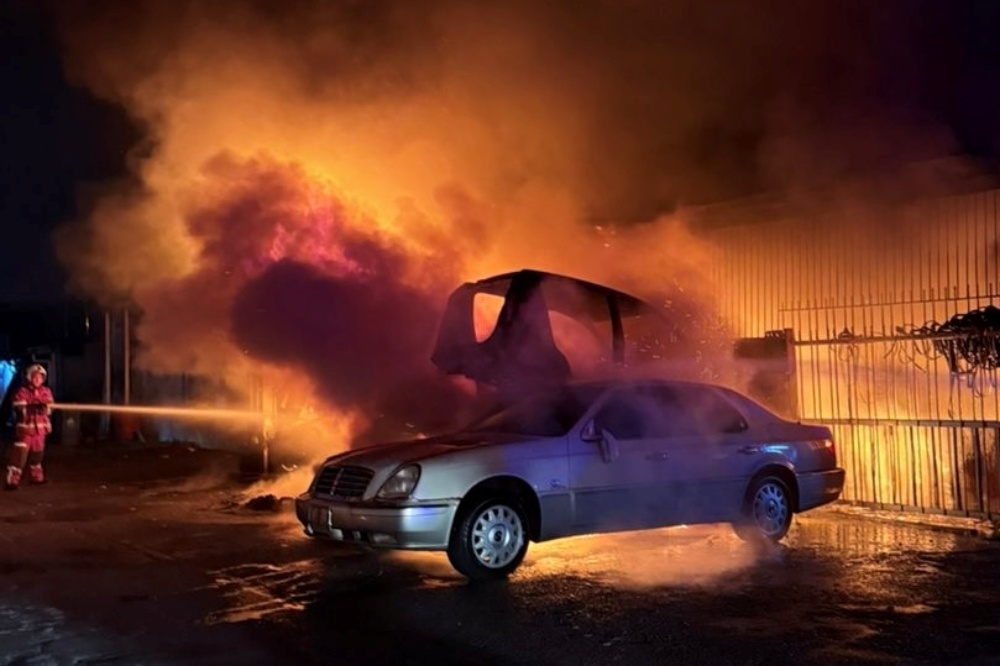 Firefighters controlling the blaze at Jalan Kwong Lee Bank in Kuching. — Picture courtesy of Fire and Rescue Department