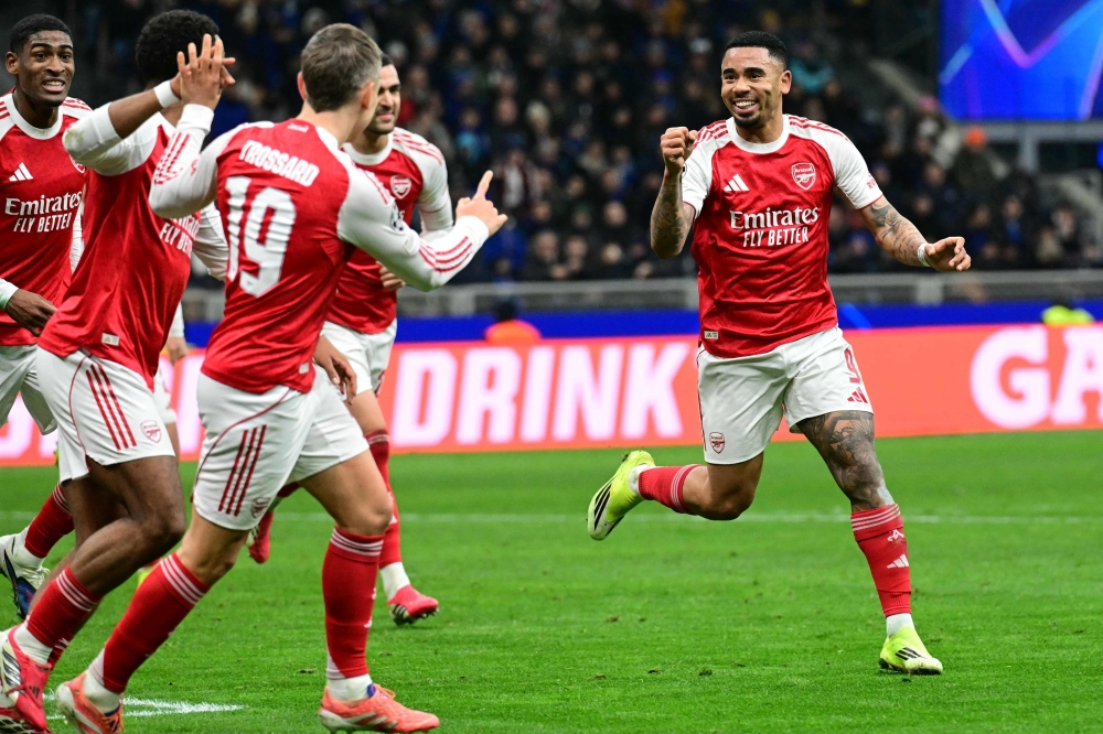 Arsenal’s Brazilian striker #09 Gabriel Jesus (C) celebrates with teammates after scoring his team second goal during the Uefa Champions League, league phase day 7, football match between Inter Milan and Arsenal at San Siro stadium in Milan, northern Italy, on January 20, 2026.
