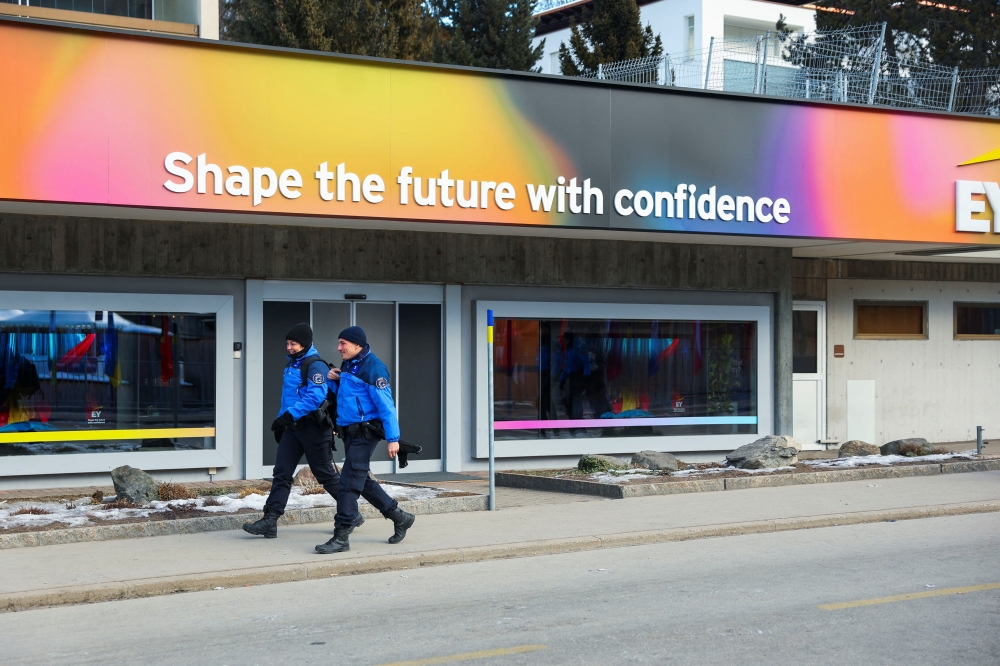 Police officers walk next to the Congress Center on the last day of the 56th annual World Economic Forum (WEF) meeting in Davos, Switzerland, January 23, 2026. — Reuters pic
