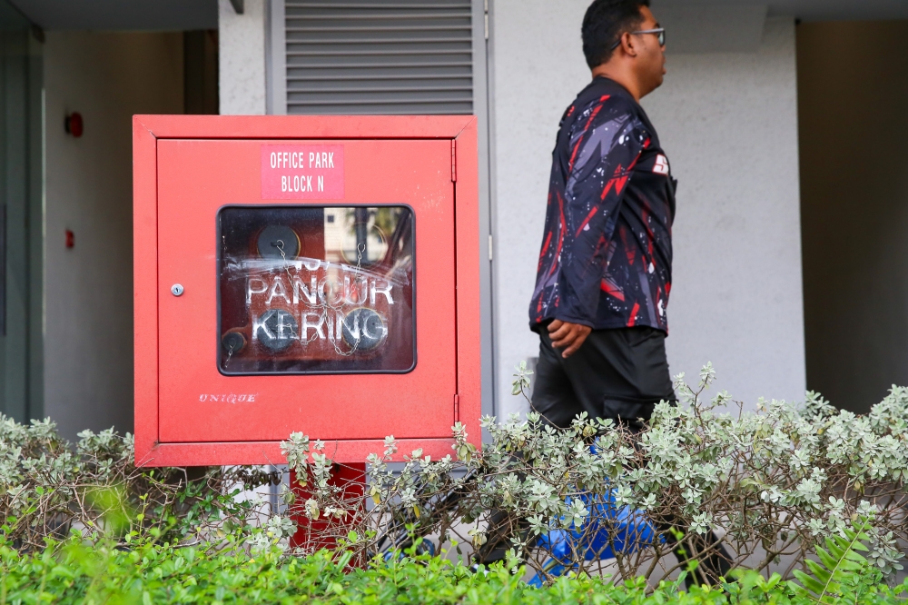 A ground-floor dry riser inlet breeching valve allows firemen to connect hoses and pump water to upper floors during an emergency. — Picture by Choo Choy May