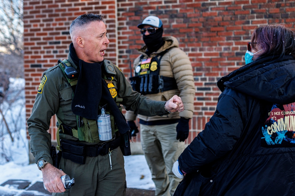 US Border Patrol Commander Gregory Bovino argues with protesters near Roosevelt High School during dismissal time as federal immigration enforcement actions sparked protests in Minneapolis, Minnesota, on January 7, 2026. — AFP pic
