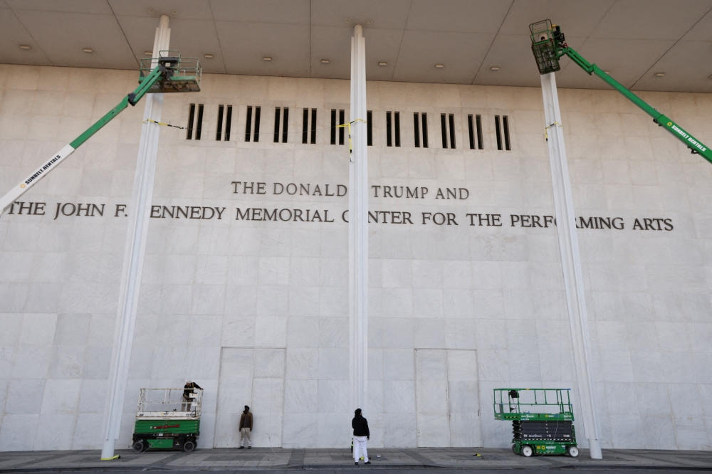 The newly added lettering for US President Donald Trump's name is displayed at the facade of the John F. Kennedy Center for the Performing Arts, a day after its board announced it would rename the institution The Donald J. Trump and The John F. Kennedy Memorial Center for the Performing Arts, in Washington, D.C. December 19, 2025. 