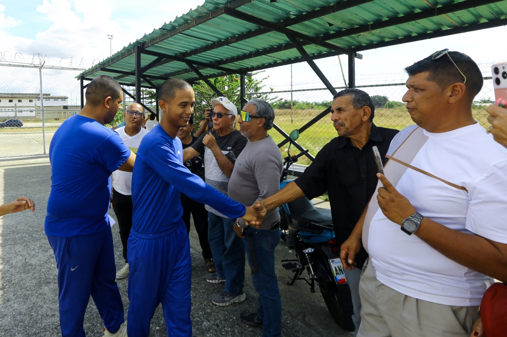 Men who were imprisoned are released from prison outside the ‘El Libertador’ prison complex, amid prisoner releases by the Venezuelan government following the US capture of Nicolas Maduro, in Tocuyito, Venezuela, January 25, 2026. — Reuters pic