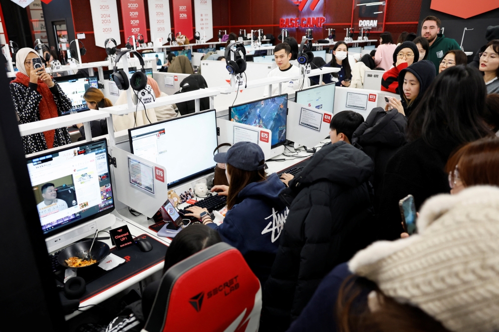 Fans of K-POP boy band BTS, known as ARMY, gather as a fan almost succeeds in booking ticket for BTS’s first South Korea concerts in years as part of the world tour, at a PC cafe in Seoul, South Korea, January 22, 2026. — Reuters pic 