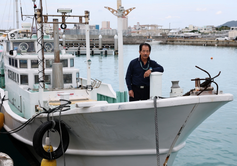 Hitoshi Nakama, a fisherman and local councilor in Ishigaki who has been fishing around a group of disputed islands called Senkaku Islands in Japan, also known in China as Diaoyu Islands, poses on his fishing boat during an interview with Reuters at a port in Ishigaki, Okinawa Prefecture, Japan, January 13, 2026. — Reuters pic