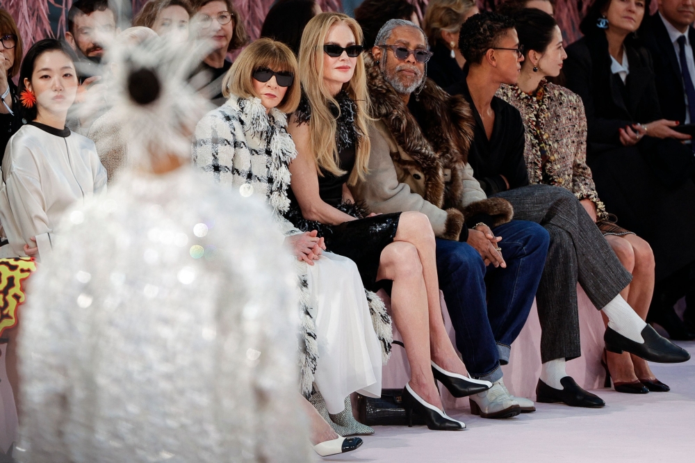 British-US fashion editor Anna Wintour (left, Australian-US actress Nicole Kidman (centre), and US artist Arthur Jafa (right) look at the models presenting creations for Chanel for Women’s Haute Couture Spring/Summer 2026 collection fashion show as part of the Paris Haute Couture Fashion Week, in Paris, on January 27, 2026. — AFP pic