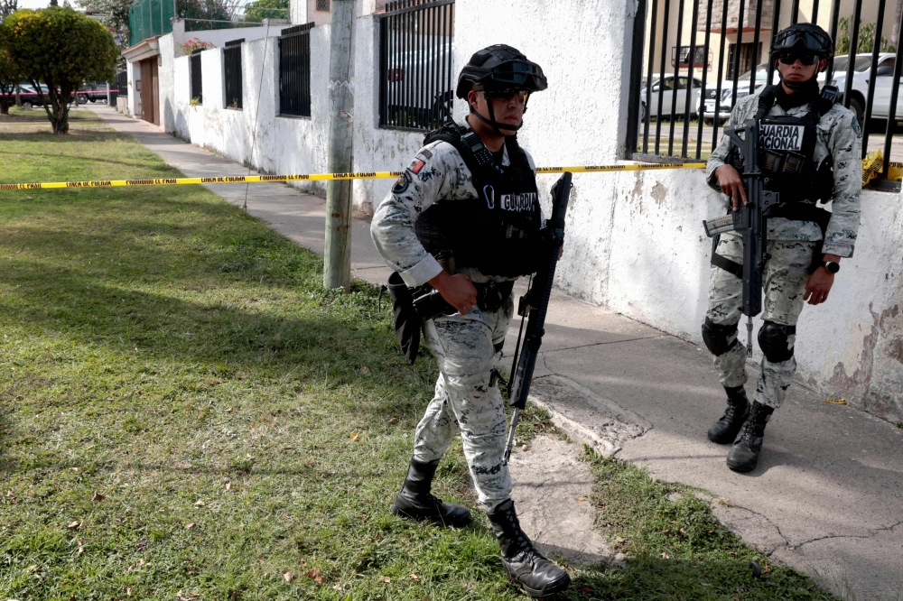 Members of the Mexico National Guard patrol the area where a hotel owner was attacked, an incident that left one assailant dead in a hospital and five people wounded by gunfire in a commercial area of Zapopan, Jalisco on January 27, 2026. — AFP pic