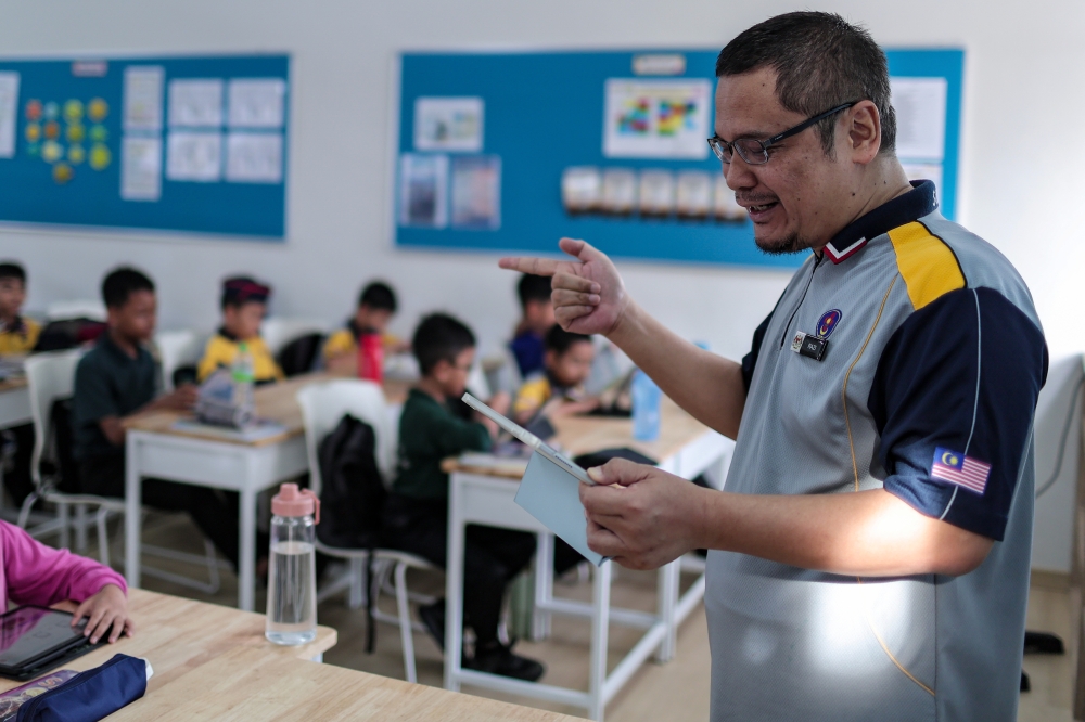 Teachers can track students’ progress across cognitive, social, and emotional development using digital tools, helping ensure that each child is supported through the Year One transition. — Bernama pic